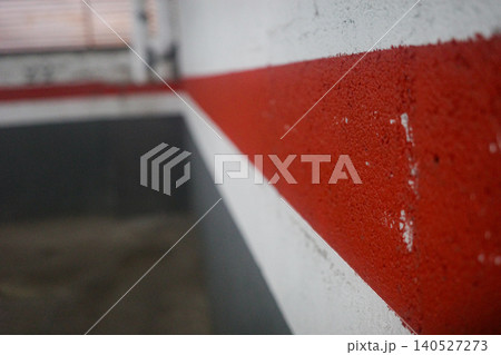 Red And White Painted Wall In Underground Parking Garage Red And White Painted Wall In Underground Parking Garage 140527273