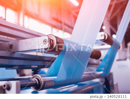 Modern automated production line in factory. Plastic bag manufacturing process Modern automated production line in factory. Plastic bag manufacturing process 140528111