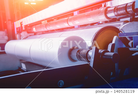 Modern automated production line in factory. Plastic bag manufacturing process Modern automated production line in factory. Plastic bag manufacturing process 140528119