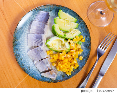 salted herring served with ripe avocado and corn salted herring served with ripe avocado and corn 140528697