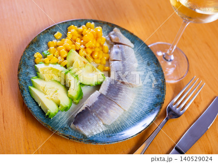 salted herring served with ripe avocado and corn salted herring served with ripe avocado and corn 140529024