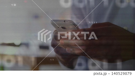 Holding dark-skinned male hands typing on smartphone at workspace, with digital overlays visible Holding dark-skinned male hands typing on smartphone at workspace, with digital overlays visible 140529879