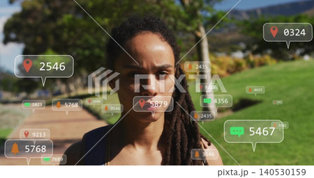 Walking adult woman wearing dark tank top and backpack on paved campus path, AR overlays floating 140530159