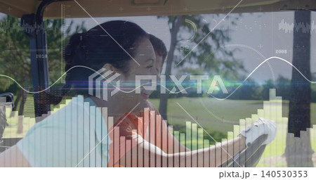 Driving woman golfer in orange polo, white golf glove, steering golf cart on fairway, HUD overlays Driving woman golfer in orange polo, white golf glove, steering golf cart on fairway, HUD overlays 140530353