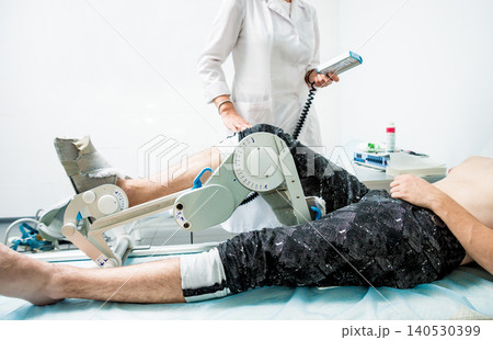 Patient on CPM (continuous passive range of motion) machines. Patient on CPM (continuous passive range of motion) machines. 140530399