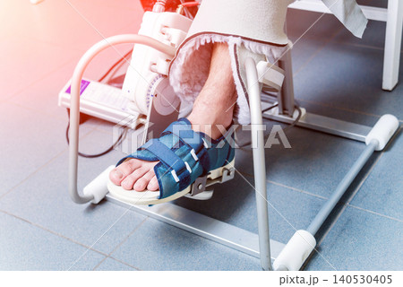 Patient on CPM (continuous passive range of motion) machines. Device to provide anatomically correct motion to both the ankle and subtalar joints. Patient on CPM (continuous passive range of motion) machines. Device to provide anatomically correct motion to both the ankle and subtalar joints. 140530405