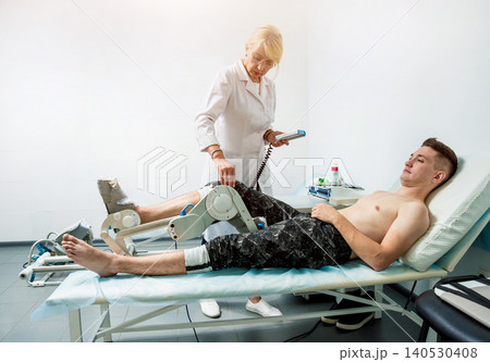 Patient on CPM (continuous passive range of motion) machines. 140530408