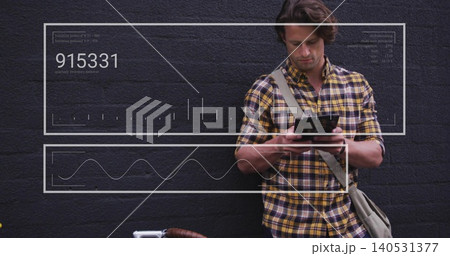 Leaning adult man yellow-plaid shirt checking phone at brick-wall bag bike data-overlay, copy space 140531377