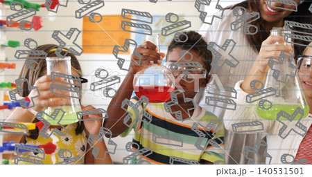 Male child in striped shirt holding red round-bottom flask in school lab, goggles and math overlay 140531501