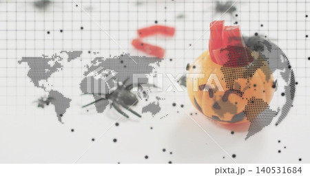 Showing mini jack-o'-lantern wearing red crown on grid mat, spider prop and map overlay, copy space Showing mini jack-o'-lantern wearing red crown on grid mat, spider prop and map overlay, copy space 140531684