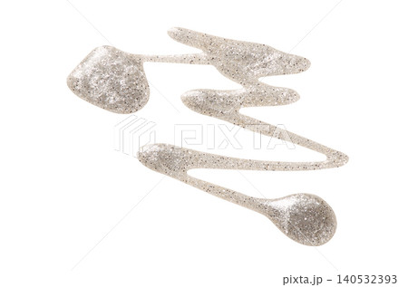 A sample of silver nail polish with a shimmer and metallic effect. Isolated on a white background. A sample of silver nail polish with a shimmer and metallic effect. Isolated on a white background. 140532393
