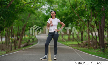 Black woman with towel on park path for outdoor fitness Black woman with towel on park path for outdoor fitness 140532798