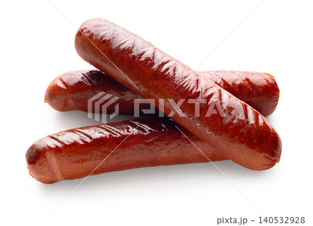Appetizing fried sausages close-up on a white isolated background Appetizing fried sausages close-up on a white isolated background 140532928