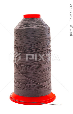 spool of colored thread on a white isolated background 140532932