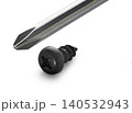 Construction screw and screwdriver on white isolated background 140532943
