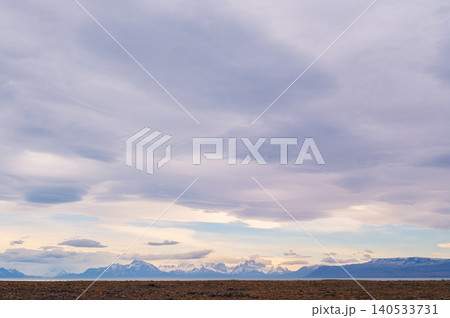 Patagonia mountain landscape under cloudy sky at sunset 140533731