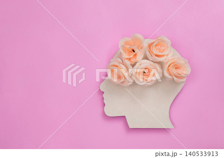 Human head silhouette with flowers representing mental wellness and self-care Human head silhouette with flowers representing mental wellness and self-care 140533913