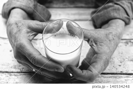 old hands with magnifier 140534248