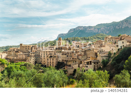 Panoramic view of Cornudella de Montsant with traditional stone houses, church bell tower and Montsant mountain range in Catalonia Spain Panoramic view of Cornudella de Montsant with traditional stone houses, church bell tower and Montsant mountain range in Catalonia Spain 140534281