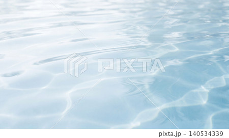 Abstract water surface ripples and reflections in clear blue liquid with abstract reflection tranquil transparent movement background backdrop clearwater peaceful Abstract water surface ripples and reflections in clear blue liquid with abstract reflection tranquil transparent movement background backdrop clearwater peaceful 140534339