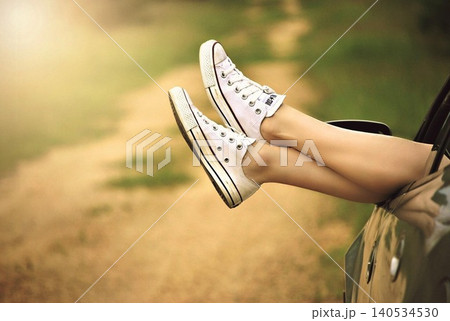 legs of a woman in a black sports car legs of a woman in a black sports car 140534530
