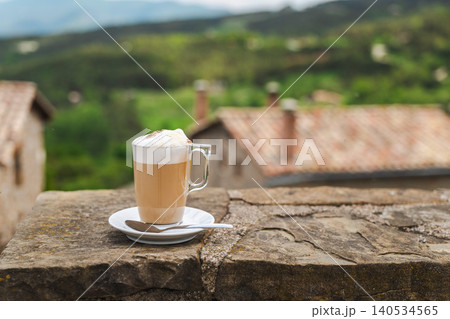 Latte coffee with scenic mountain village and countryside view 140534565