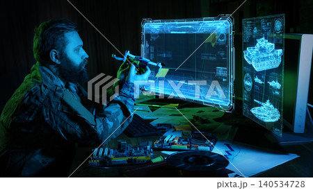 Engineer testing drone prototype with holographic military interface system. Engineer testing drone prototype with holographic military interface system. 140534728