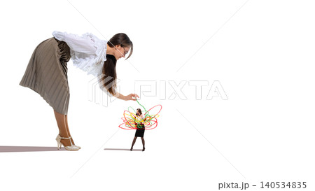 Large businesswoman controlling small stressed employee with handmade drawings. 140534835