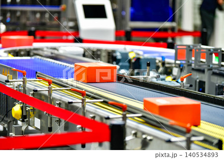 Modern industrial logistics warehouse with automated conveyor system handling smart packages	 140534893