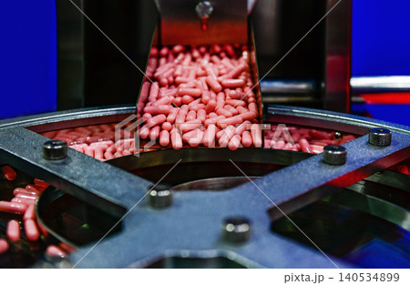 Industrial rotary capsule counter and packaging machinery in modern pharmaceutical plant Industrial rotary capsule counter and packaging machinery in modern pharmaceutical plant 140534899