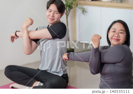 Asian woman and man stretching arms, happy fitness and wellness 140535111