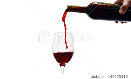 Red wine pouring into glass isolated on white background minimal composition 140535510