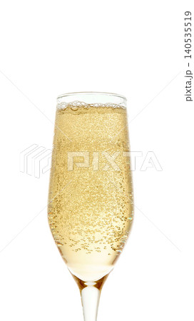 Champagne glass filled with sparkling wine and bubbles isolated on white background Champagne glass filled with sparkling wine and bubbles isolated on white background 140535519