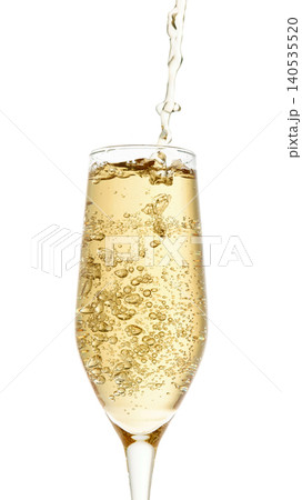 Sparkling wine pouring into glass with bubbles macro isolated on white background Sparkling wine pouring into glass with bubbles macro isolated on white background 140535520