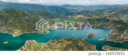 Aerial view of Siurana Reservoir and dam surrounded by rugged mountains in Catalonia, Spain. Aerial view of Siurana Reservoir and dam surrounded by rugged mountains in Catalonia, Spain. 140535653