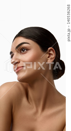 Side beauty portrait of woman with sleek hair and glowing skin on white background Side beauty portrait of woman with sleek hair and glowing skin on white background 140536268