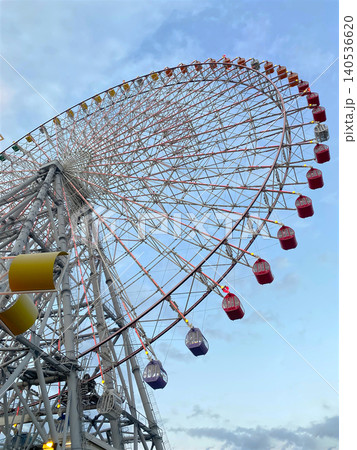 Ferris Wheel Against Blue Sky at Amusement Park from Low Angle View, copy space no people. 140536620