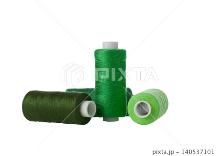 green spool of sewing thread isolated on white background 140537101