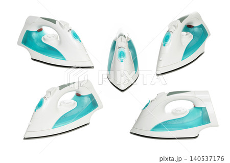 cordless iron on white background in different angles and soleplates cordless iron on white background in different angles and soleplates 140537176