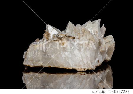 Macro mineral stone Snow quartz with calcite on a black background Macro mineral stone Snow quartz with calcite on a black background 140537288
