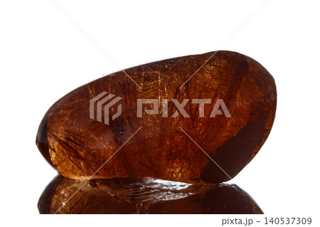 Macro mineral stone Rutile in quartz on background Macro mineral stone Rutile in quartz on background 140537309