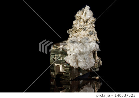 Macro mineral stone Pyrite in quartz on a black background Macro mineral stone Pyrite in quartz on a black background 140537323