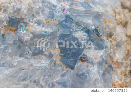 Macro mineral stone Celestine in the breed a white background Macro mineral stone Celestine in the breed a white background 140537333