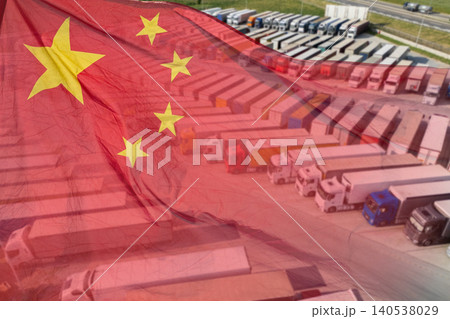 Chinese flag waving with commercial trucks in the background Chinese flag waving with commercial trucks in the background 140538029