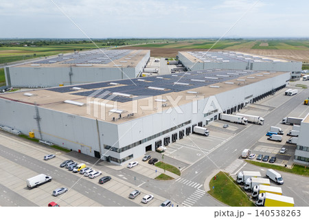 Logistics centers with solar panels on roofs. Aerial view. 140538263