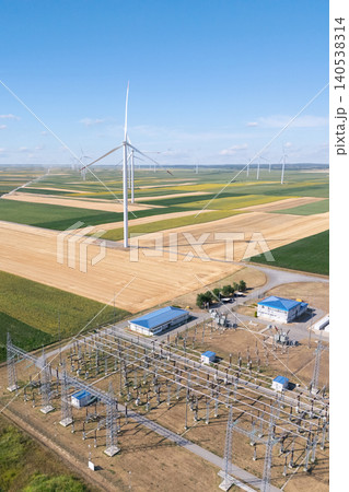 Aerial view of wind turbines with electric power station. Aerial view of wind turbines with electric power station. 140538314