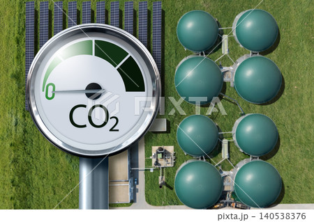 Biogas plant with CO2 emission reduction symbol. Decarbonization and carbon neutrality concept. Biogas plant with CO2 emission reduction symbol. Decarbonization and carbon neutrality concept. 140538376