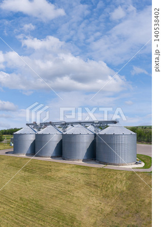 Aerial view of agricultural silos, grain elevator for storage and drying of cereals.. Aerial view of agricultural silos, grain elevator for storage and drying of cereals.. 140538402