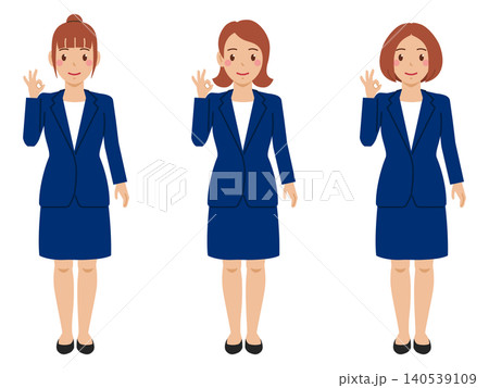 [全身] OKサインを出すカットソーにネイビースカートスーツの若い女性 140539109