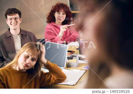 Creative office workers listening during team presentation in modern workspace. Creative office workers listening during team presentation in modern workspace. 140539520